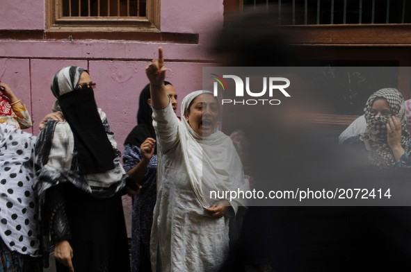 A kashmir women shouts pro-independence slogans as the body of a local pro-independence fighter  Sajad Ahmed Gilkar Arrives at his native ho...