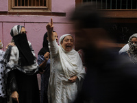 A kashmir women shouts pro-independence slogans as the body of a local pro-independence fighter  Sajad Ahmed Gilkar Arrives at his native ho...