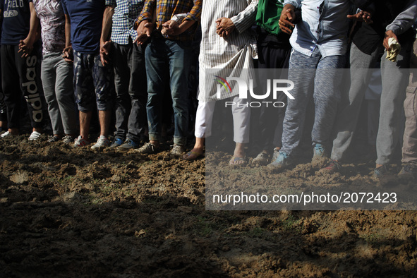 Kashmiri Mourners Prepare for the funeral prayers of local pro-independence fighter  Sajad Ahmed Gilkar  in old city Srinagar in on july 12...