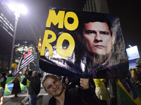 People celebrate in Sao Paulo, Brazil, July 12, 2017, after Brazil's former president Luiz Inacio Lula da Silva was sentenced to nearly 10 y...
