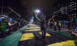 People celebrate in Sao Paulo, Brazil, July 12, 2017, after Brazil's former president Luiz...