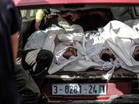 Body of a member of the Abu Nejim family, whom medics said was killed along with other eight family members by an Israeli air strike, during...
