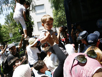 Mothers with their children protest outside the German embassy in Athens on Wednesday 19 July 2017. The refugees, mainly Syrians from the re...