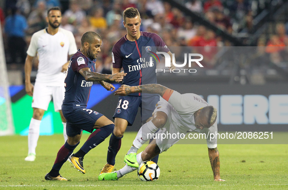Roma midfielder Radja Nainggolan (4) vies with Paris Saint-Germain Dani Alves (32) during an International Champions Cup match at Comerica P...