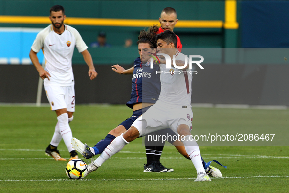 AS Roma midfielder Diego Perotti (8) battles with Paris Saint-Germain midfielder Adrien Rabiot (25) for possession of the ball during an Int...