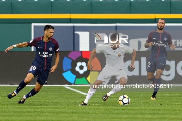 Roma Lorenzo Pellegrini (7) carries the ball under the pressure of Paris Saint-Germain midfielder Javier Pastore (10)  and  forward Jesé Rod...