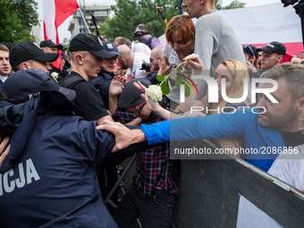 Protesters try to break through a barrier guarded by Policemen in front of the Sejm (Lower House of Polish Parliament) building in Warsaw, P...