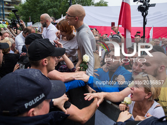 Protesters try to break through a barrier guarded by Policemen in front of the Sejm (Lower House of Polish Parliament) building in Warsaw, P...
