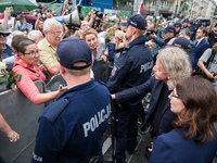 Kamila Gasiuk-Pihowicz and Krzysztof Mieszkowski from opposition Nowoczesna party speaks to the protesters in front of the Sejm (Lower House...