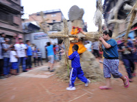 Nepalese devotees rotating straw effigy demon Ghantakarna during the Gathemangal festival celebrated at Bhaktapur, Nepal on Friday, July 21,...