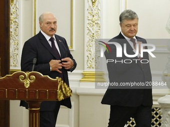 Belarussian President Alexander Lukashenko (L) and Ukrainian President Petro Poroshenko (R) during a meeting in Kiev, Ukraine, 21 July , 201...