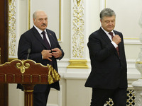 Belarussian President Alexander Lukashenko (L) and Ukrainian President Petro Poroshenko (R) during a meeting in Kiev, Ukraine, 21 July , 201...