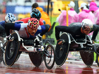 L-R Rawat Tana of Thailand  and Marcel Hug of Switzerland compete Men's 5000m T54 Final during World Para Athletics Championships at London...