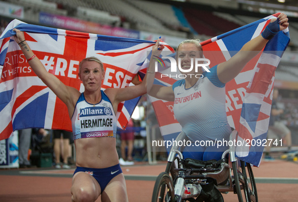 Hannah Cockroft of Great Britain celebrates after winning gold in the Women's 400m T34 Final alongside Georgina Hermitage who won gold in th...