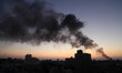 Smoke raises over Gaza City after an Israeli airstrike Sunday, Aug. 10, 2014.  