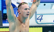 US Caeleb Remel Dressel competes in the mixed 4x100m freestyle final during the swimming c...