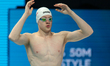 Pawel Juraszek (POL) competes in a heat of the men's 50m freestyle during the swimming com...