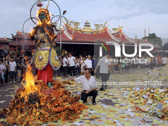 Combustion gods as offering traditional Indonesian Ethnic Chinese ancestors and their ancestors are held every seventh month of the Chinese...