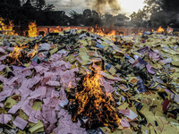 The burning of paper money made from the written words of the ancestral Indonesian Chinese community in celebration of the Hungry Ghost Fest...