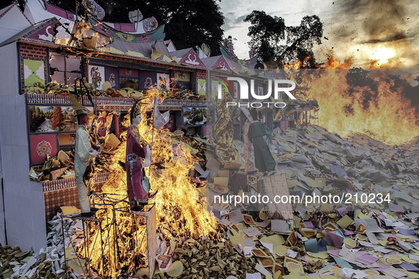 The houses were burned as offerings Ethnic Chinese Indonesian ancestors at Hungry Ghost Festival celebration ceremony held at the East Mount...
