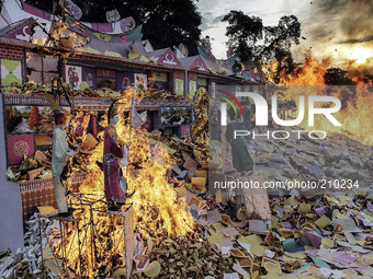 The houses were burned as offerings Ethnic Chinese Indonesian ancestors at Hungry Ghost Festival celebration ceremony held at the East Mount...