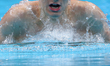 Poland's Dawid Szwedzki competes in a heat of the men's 400m individual medley during the...