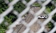 SUV with the Philadelphia Police Department (PPD) is parked next to the train track at the...