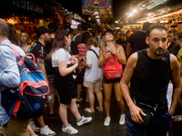Tourists visit La Boqueria market on August 8, 2017 in Barcelona, Spain. In the past year there have been a series of protests as residents...