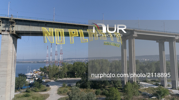 Greenpeace activists wave a big 50 metters long and 15 metters tall transperant wich says: No Plastic" over 60 metters high Asparuhov bridge...