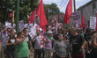 Protesters carry signs and flags during the Unite the Right free speech rally at Emancipat...