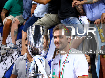 Lazio's midfielder from Bosnia-Herzegovina Senad Lulic holds the trophy  after the Italian Supercup match between Juventus and SS Lazio at S...