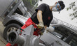 Worker rust remove use high pressure air at mohenic garages yard in Paju, South Korea. A 2...