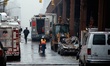 Government officials from different departments respond to a gas leak explosion that flatt...