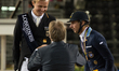 German rider Sönke Rotheberger and Swedish rider Patrik Kittel congratulate each other at...