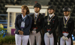 The Danish dressage team arrives at the price giving ceremony for the team dressage compet...