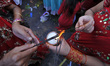 Nepalese devotees offering oil and butter lamps during Teej festival celebrations at Pashu...