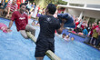 A man expression before he fell to the pool after being hit during the pillow battle. In o...