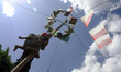 Indonesian men compete for prizes in climbing the greasy pole called "panjat pinang" durin...