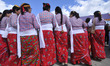 Nepalese women from far western region of Nepal in a traditional attire sings and dance as...