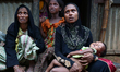 New Rohingya refugees sit near the Kutupalang makeshift refugee camp, in Cox’s Bazar, Bang...