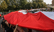 Committee of Defence of Democracy (KOD) members with giant Polish flag are seen in Gdansk,...