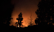 A wildfire burns in La Tuna Canyon in Los Angeles, California on September 1, 2017. More t...
