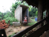Villagers look along with their well furnished toilets as they are inspired by some local social workers as they are use toilets to make bet...