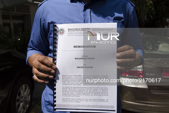 Khairul Azwan Harun(41, politician) who Deputy Leader of UMNO(United Malays National Organisation) Youth holds a memorandum outside UN HQ in...