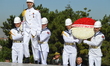 Turkish soldiers carry wreaths during a march marking the 94th anniversary of the main opp...