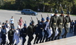 Turkish soldiers walk to change the guard during a march marking the 94th anniversary of t...