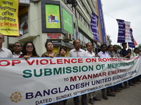 Bangladesh United Buddhist Forum activist hold up Placard during protest rally demanding stop violence on Rohingya in Myanmar near Myanmar E...