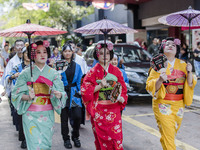 Japanese ladies living in Malaysia wearing traditional Yukata costumes during the annual 'Bon Odori' festival celebrations in Kuala Lumpur,...