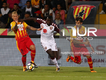 Amato Ciciretti (L) and Lorenzo Venuti (R) of Benevento compete with Niang M'Baye (C) of Torino during the Serie A match between Benevento C...