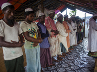 Rohingya Muslim refugees taking Asar prayer at a temporary makeshift shelter after crossing over from Myanmar into the Bangladesh side of th...